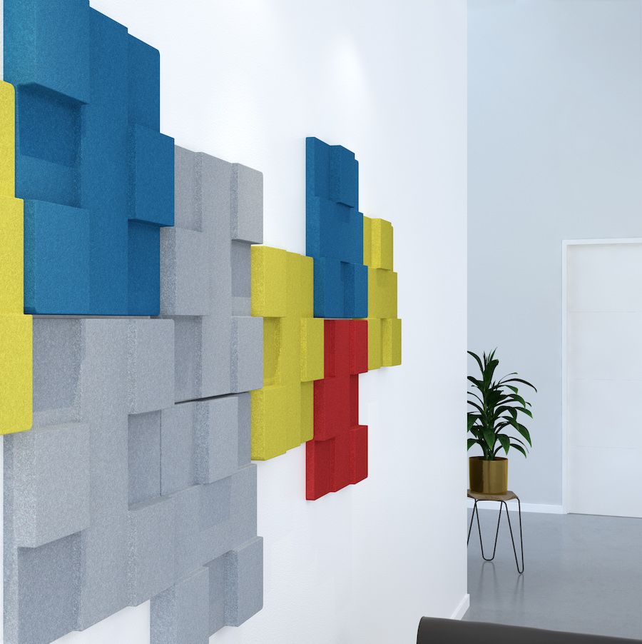 Image of yellow, blue, grey & red Urban acoustic tiles attached to wall in a room. Acoustic tiles part of Acoustek's Newport range, sold & manufactured by Acoustek Australia & UK.